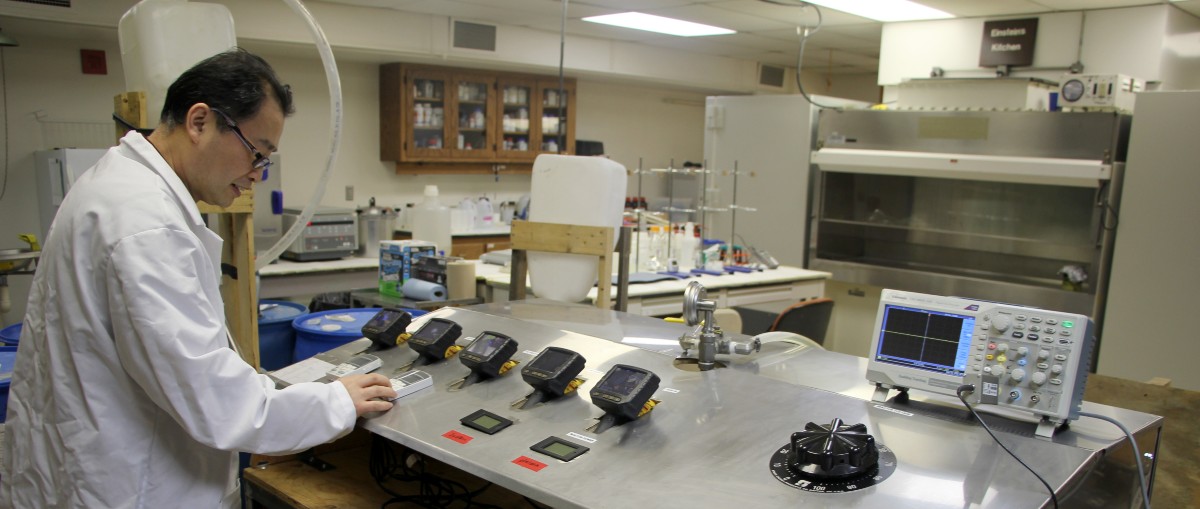 Researcher looking at liquid plasma equipment