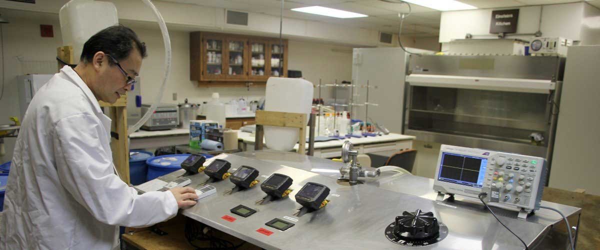 Researcher looking at liquid plasma equipment